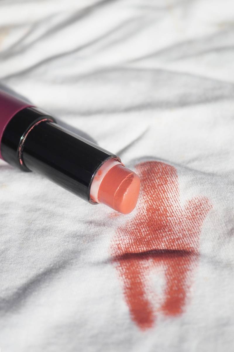 Lipstick stain removal from clothing