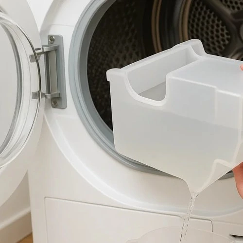 Vaciar el depósito de agua de la secadora